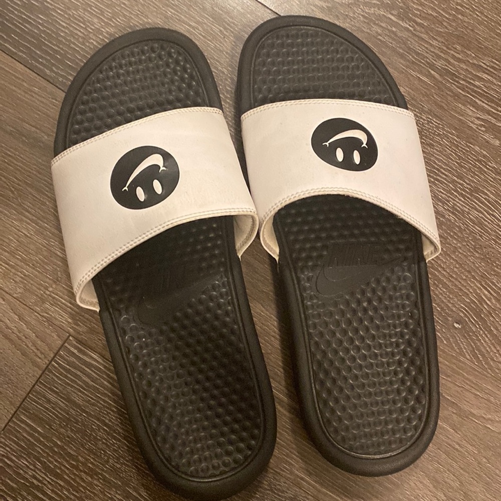 Black & white Nike Smile slides